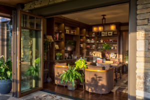 Gentlemans office with accordian doors to outdoor patio