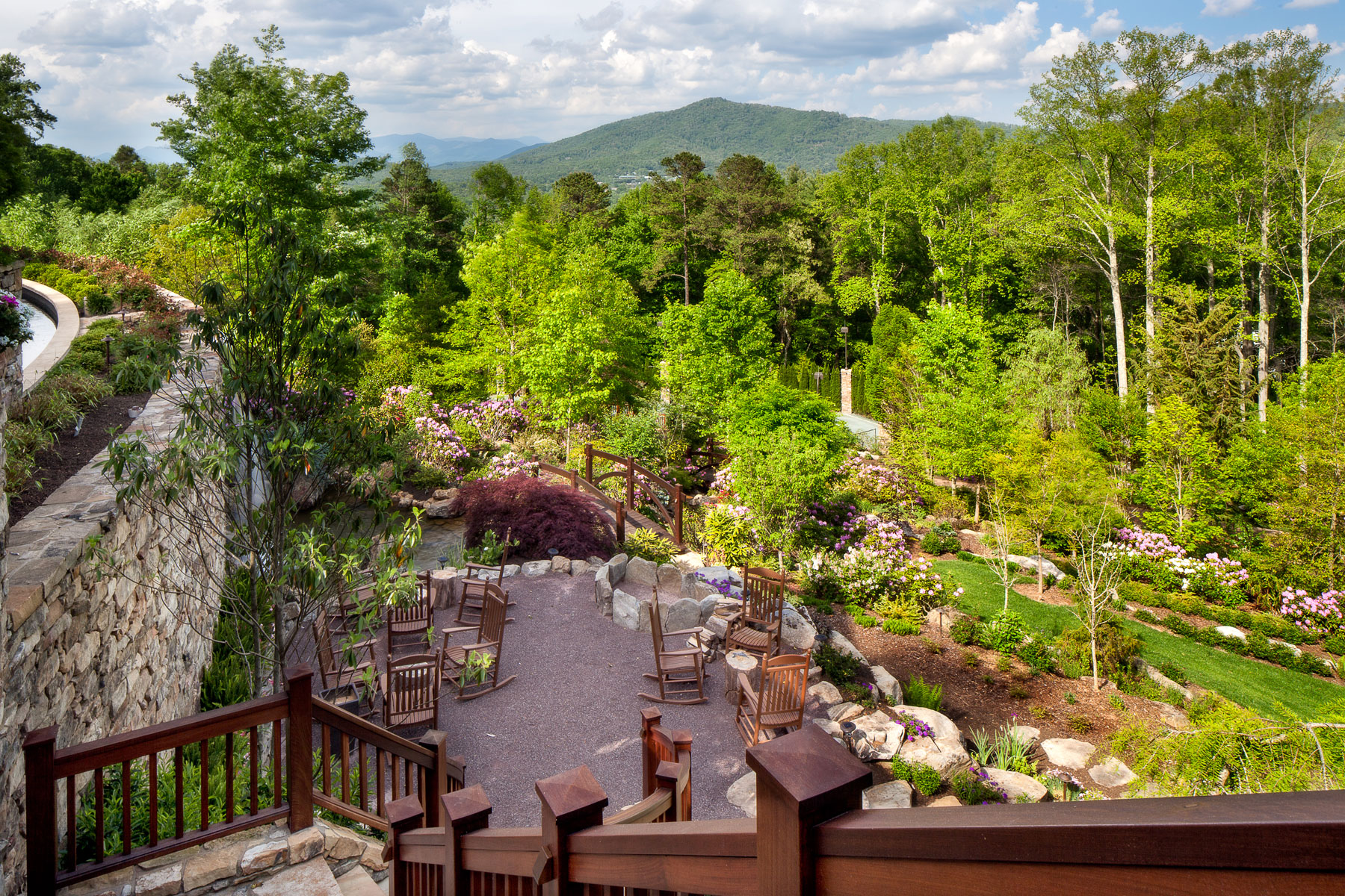 Mountainside, terraced seating area next to waterfall