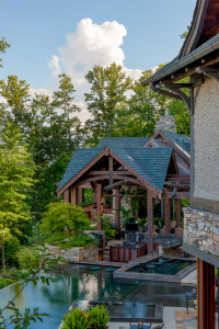 Outdoor kitchen with pitched room and trellis in mountain style