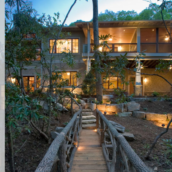 Bridge in backyard of mountain craftsman home