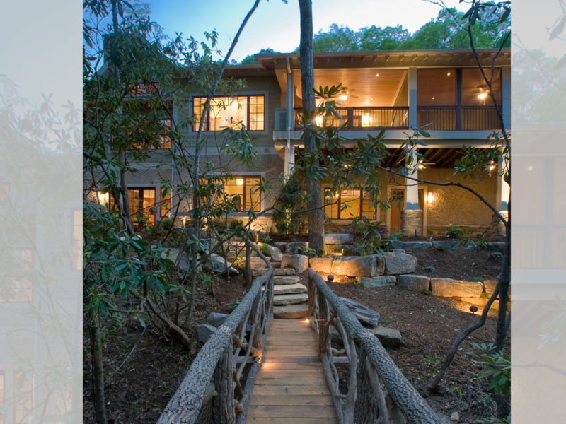 Bridge in backyard of mountain craftsman home