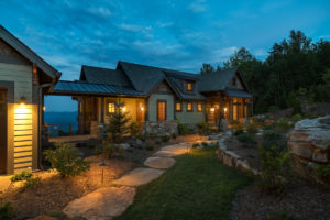 Modern rustic mountain home design with breezeway and sweeping mountain views