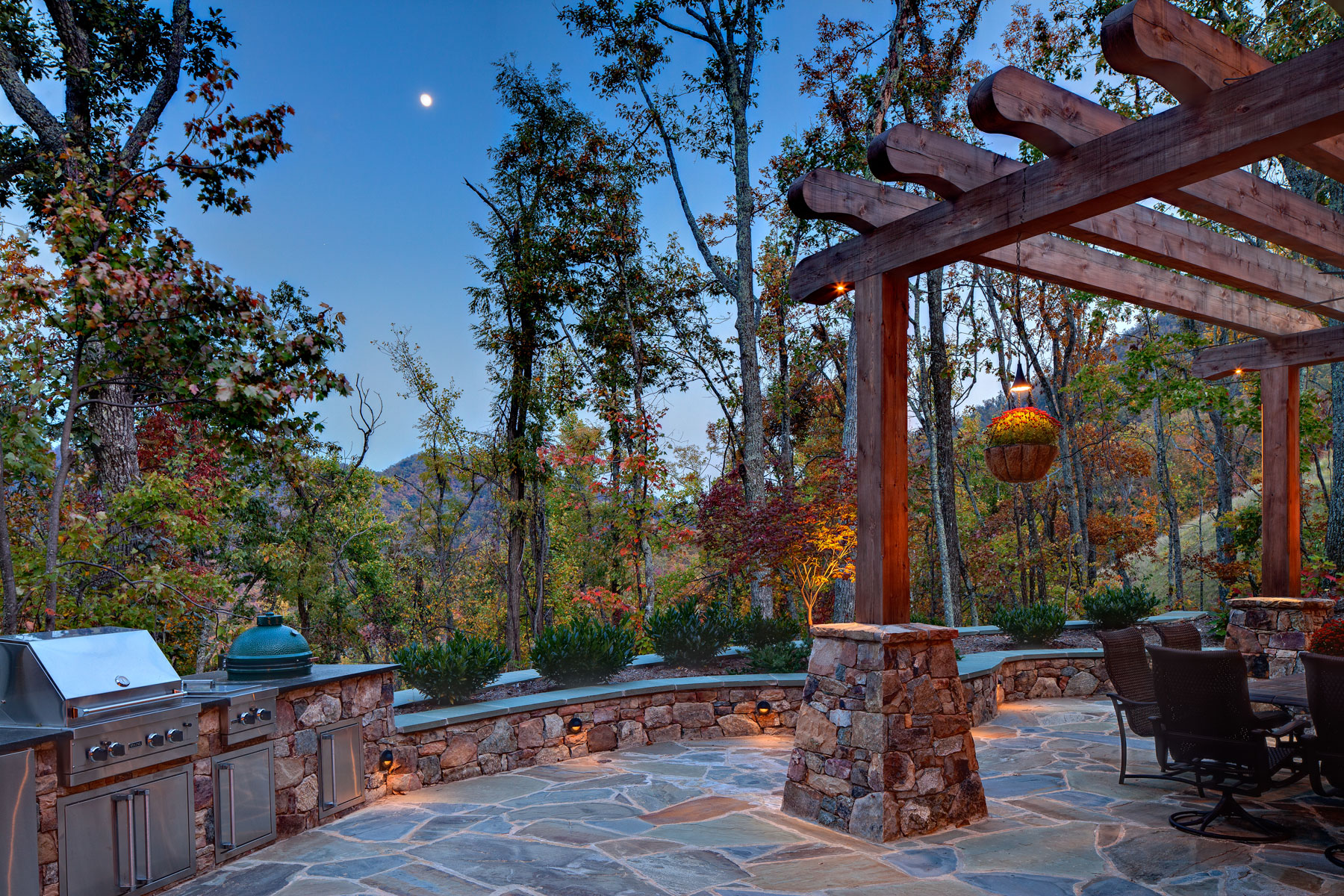 Custom Outdoor Kitchen with Stone Patio, Trellis, Grill and Green Egg in the Black Mountain Family Lodge