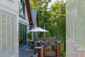 Back deck seating area in luxury mountain home renovation