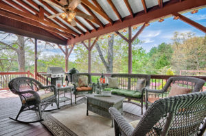 Covered deck overlooking backyard