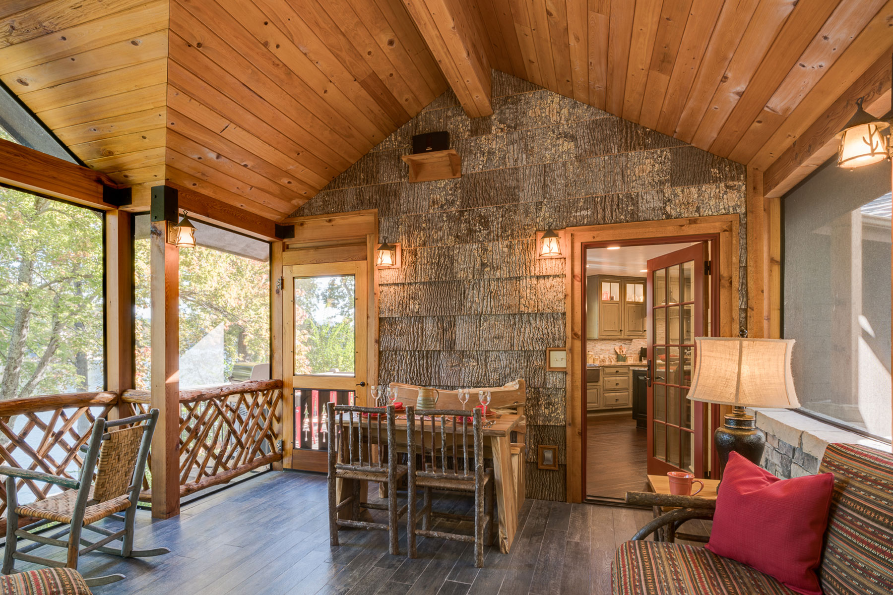 Outdoor dining in a rustic porch in this Lake Lure Cottage