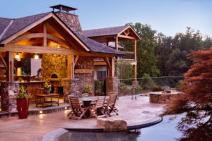 New outdoor kitchen with pizza oven in Weaverville renovation