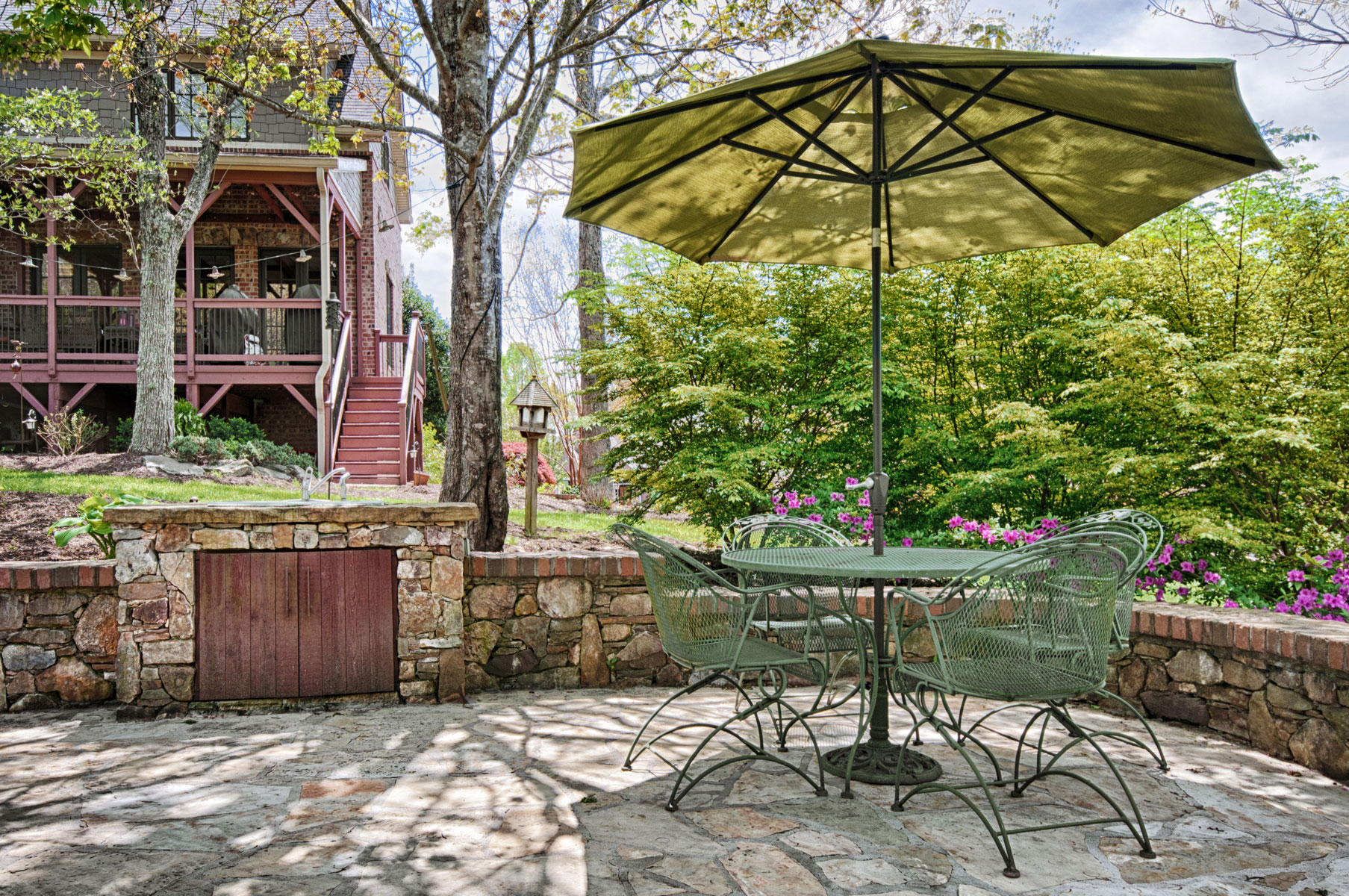 Outdoor sink adjacent to seating area