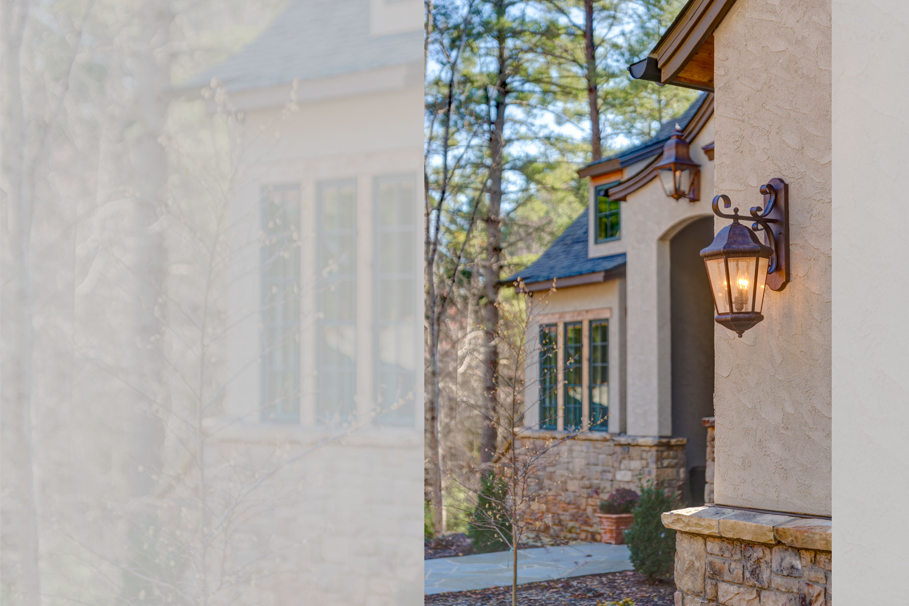 Exterior detail: light fixtures and stone work on stucco european romantic style home in Biltmore Forest