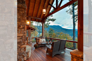 View from the front porch, relax, enjoy the stone fireplace and long range mountain views from this custom designed home.