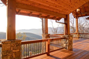 Front porch on sloped mountain lot with views