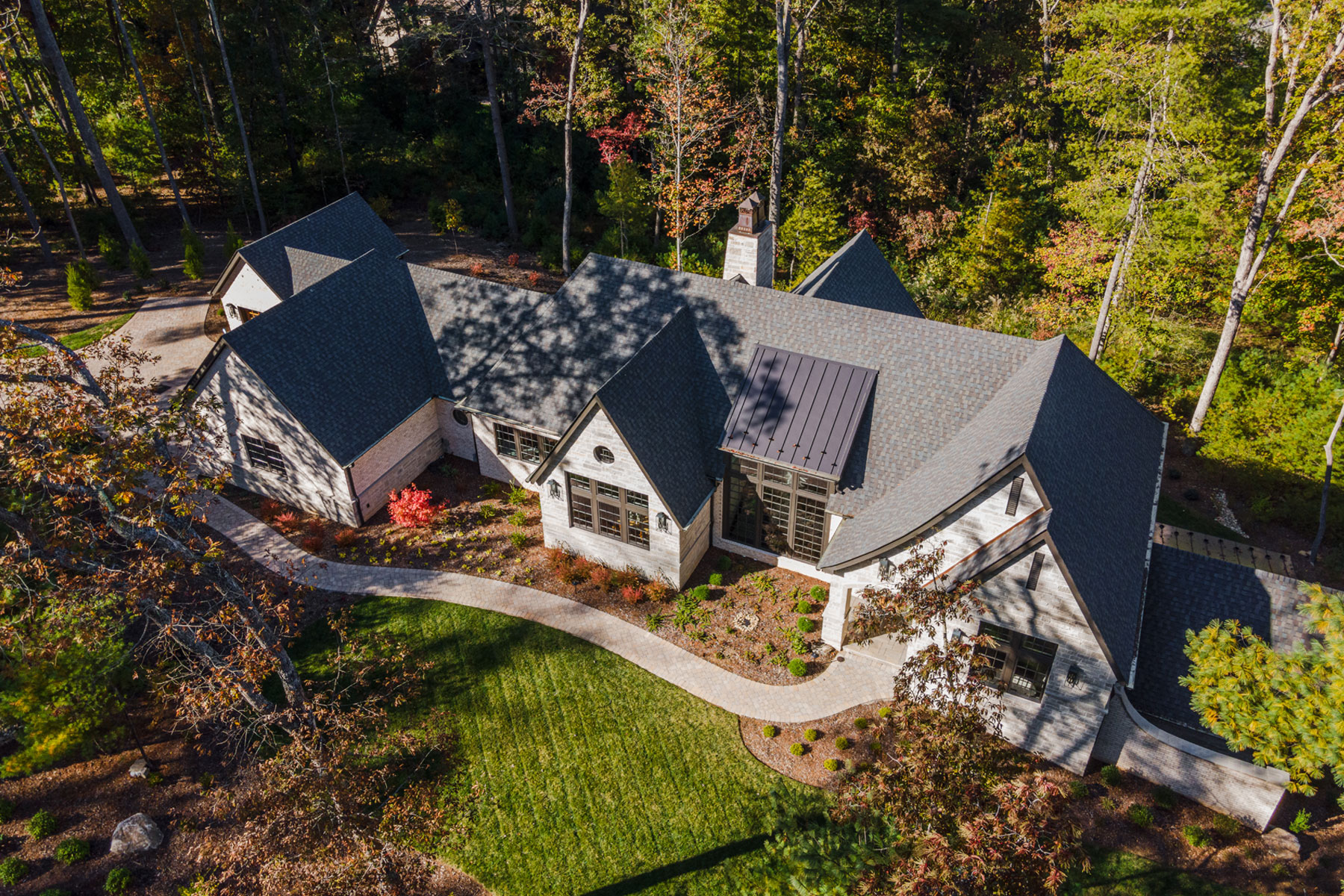 Aerial view of French Contemporary, Modern Ranch Home