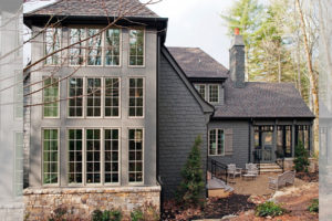 Rear view of English Manor Style Shingle Home in Asheville painted with Sherwin-Williams Urbane Bronze