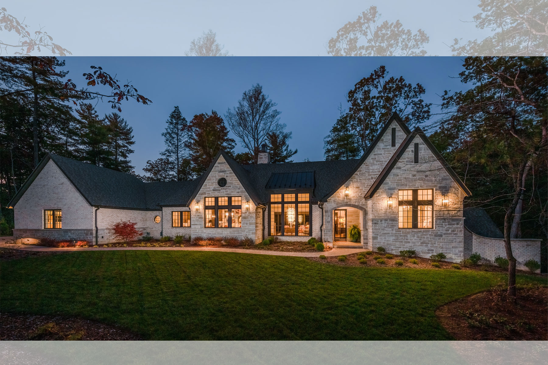 Nightime view of new Asheville home with European-influenced Architecture by Architects at ACM Design