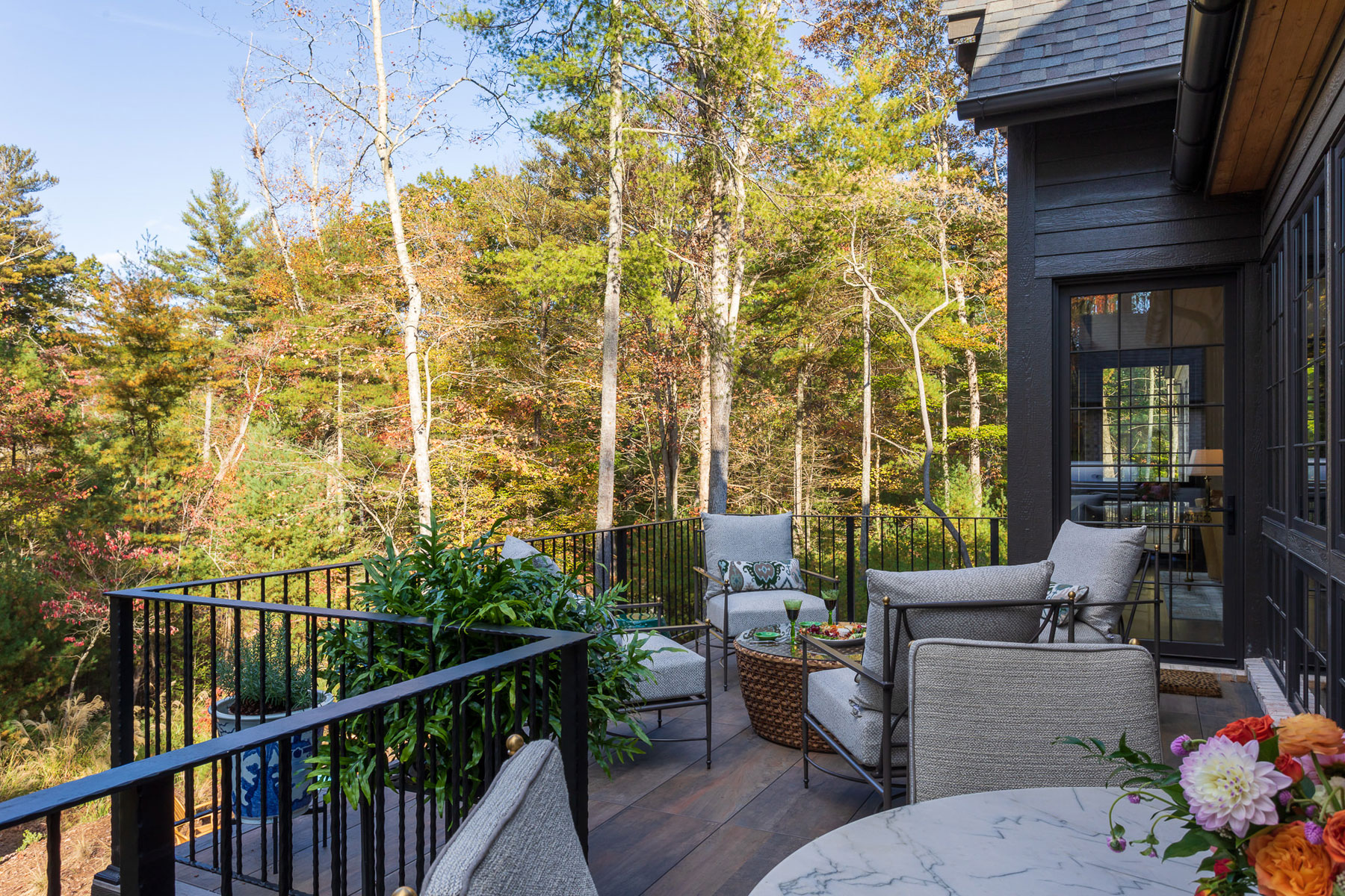 Deck off of kitchen with dining and seating area