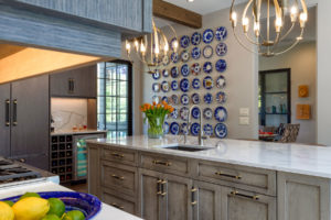 Accent wall with collector's plates in kitchen