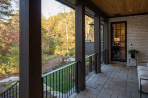 Breezeway from three car garage to main home. Breezeway with seating area.