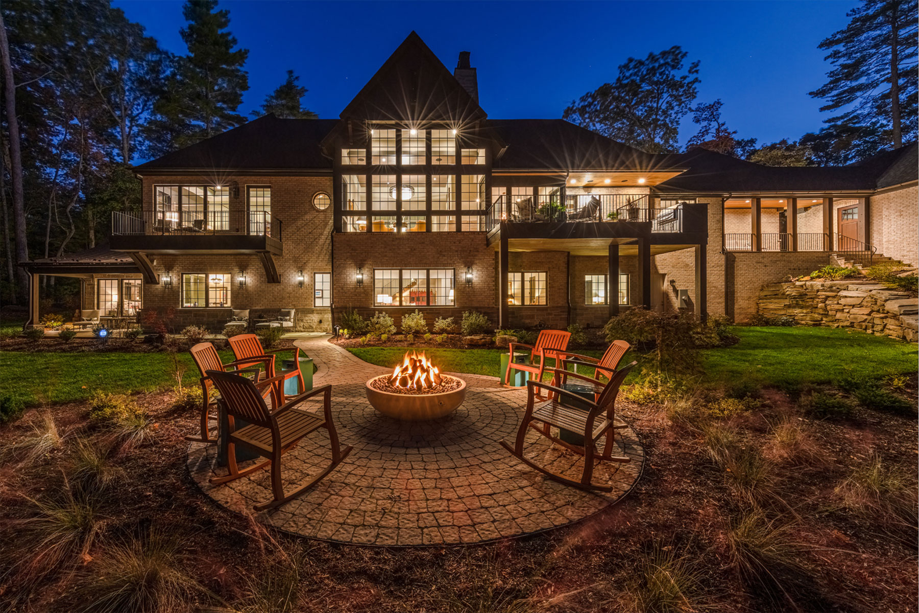 Custom designed mountain home with outdoor living area including firepit