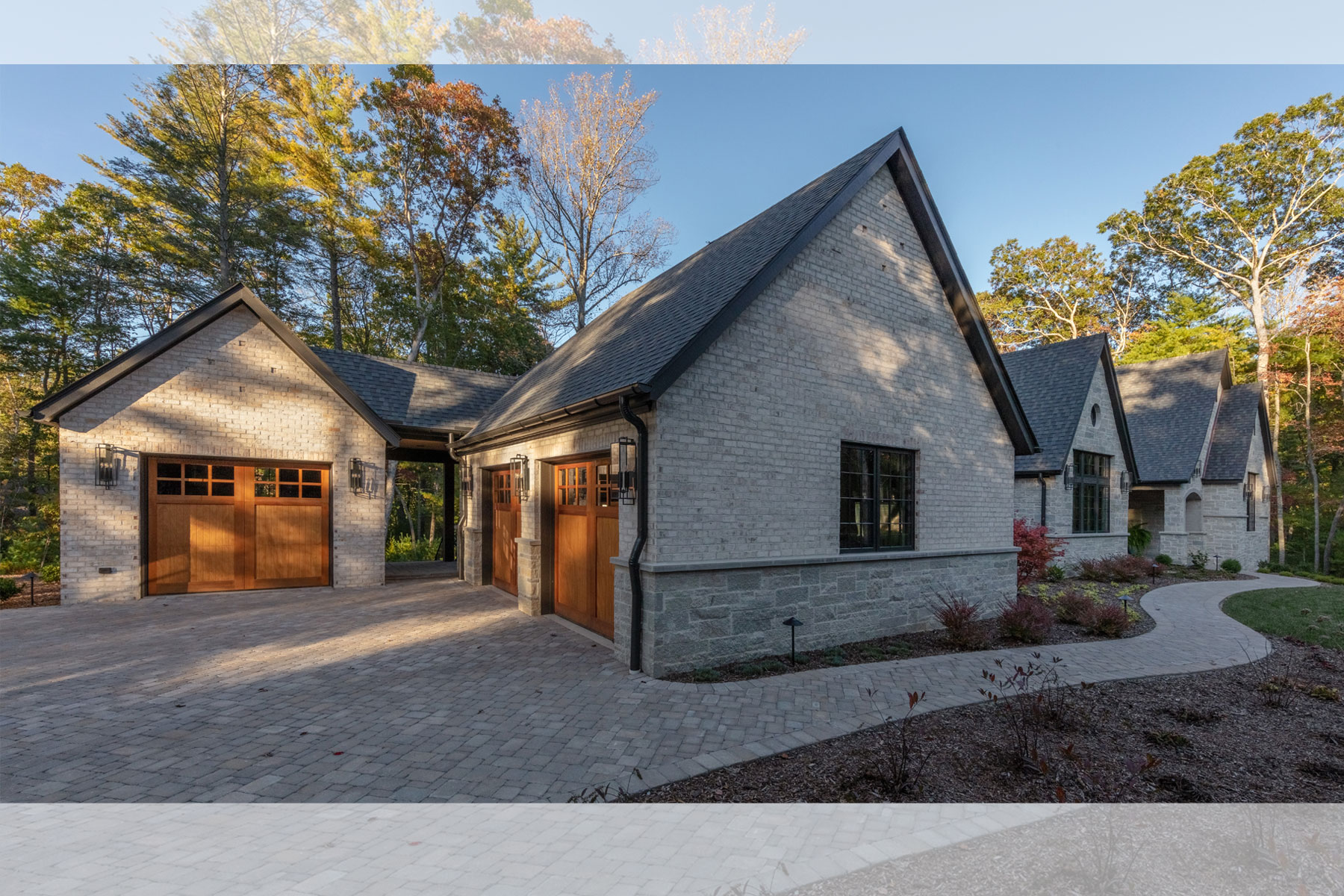 Three-car garage with wood stained doors