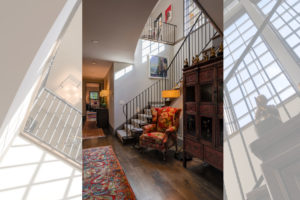 Two-story foyer with staircase to lower level