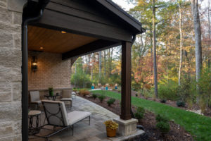 covered porch off of lower level master suite