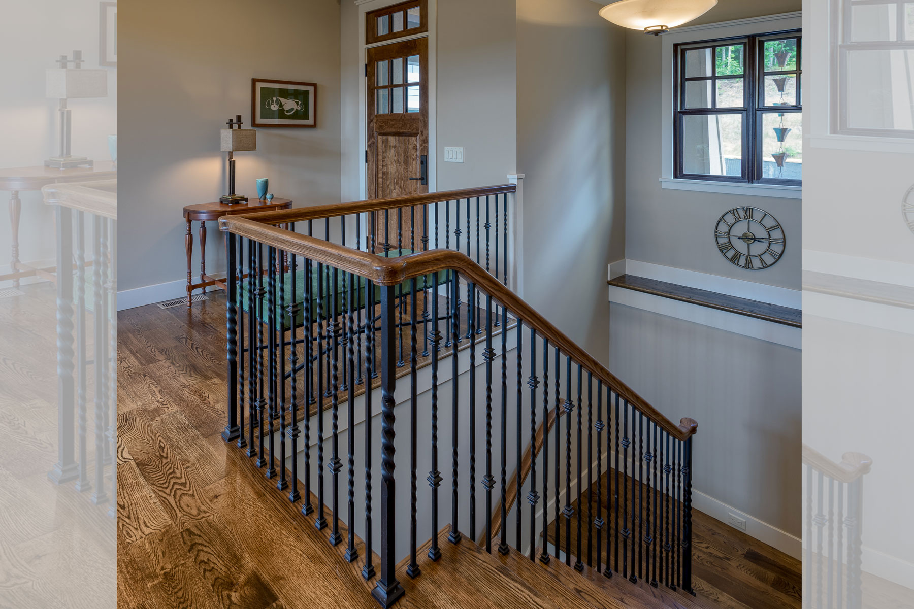 Custom stair rail design for steps leading down to lower level in mountain home