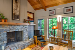 Craftsman style living room with rock fireplace