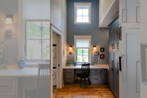 Sunny desk nook off kitchen near mudroom