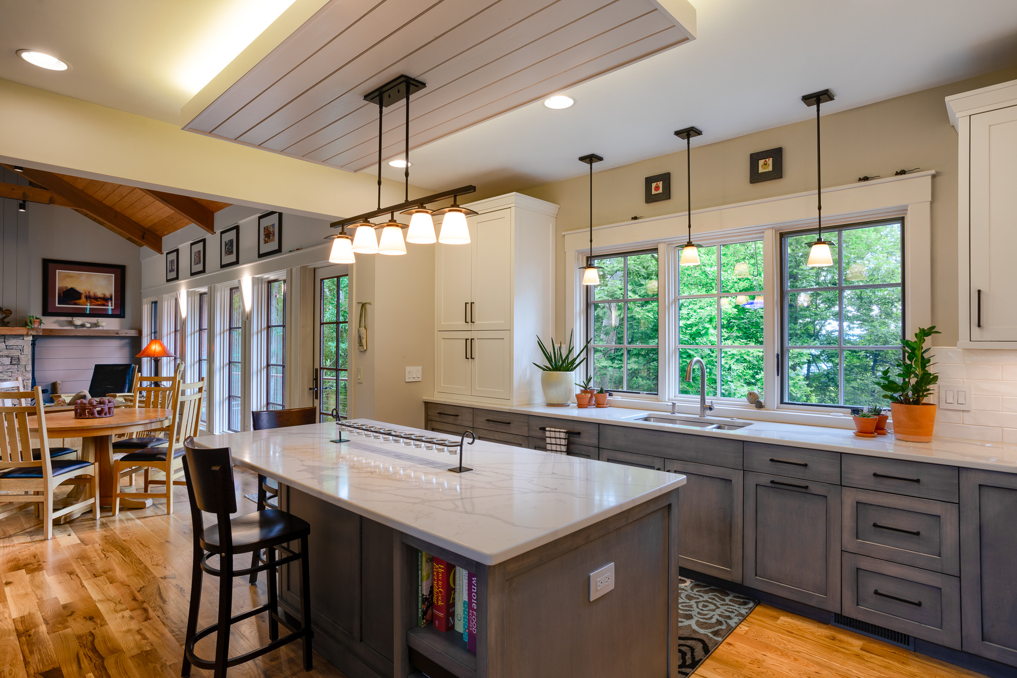 Modern mixed with industrial in craftmans mountain home kitchen with gray and white cabinets