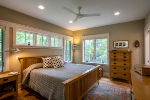 Master bedroom with transom windows over the bed