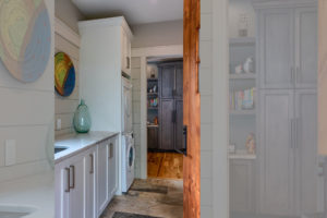 Mudroom in mountain home with laundry room