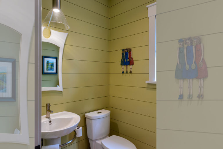 Powder room with yellow shiplap ACM Design Architecture & Interiors
