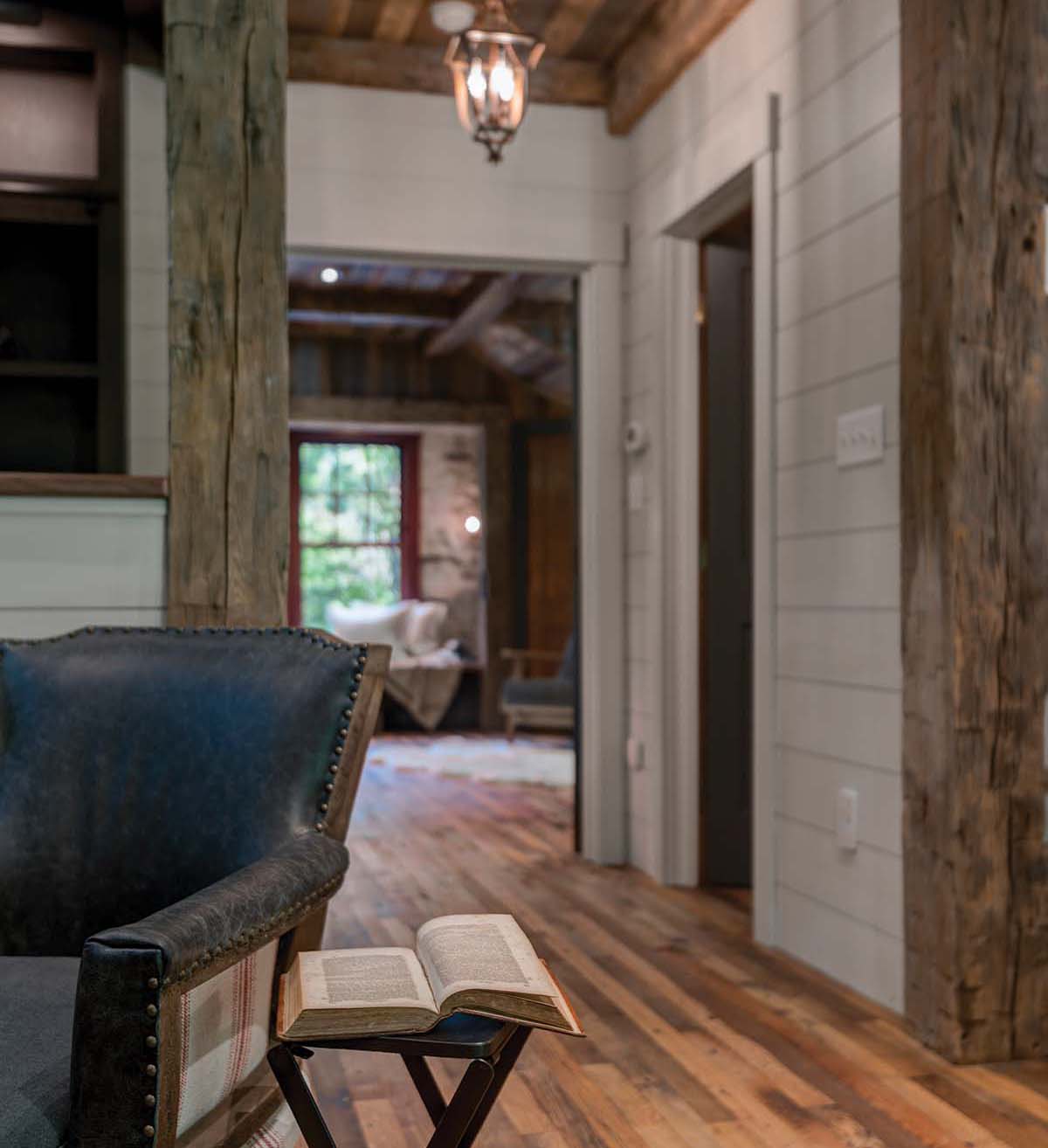 Elegant sconces light the way in this small hallway