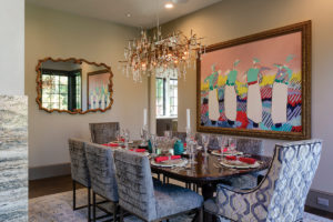 Formal dining room with modern art and modern style crystal chandelier