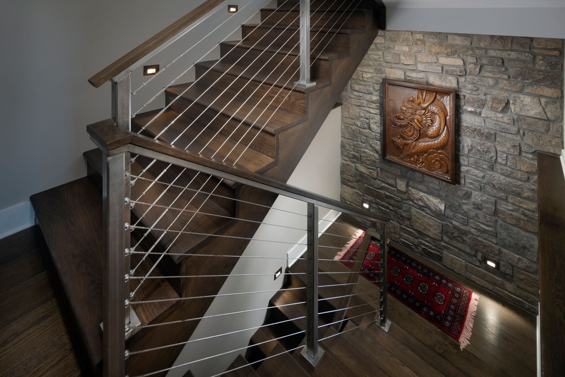 mountain-home-modern-wood-stairs-basement-cable-railing