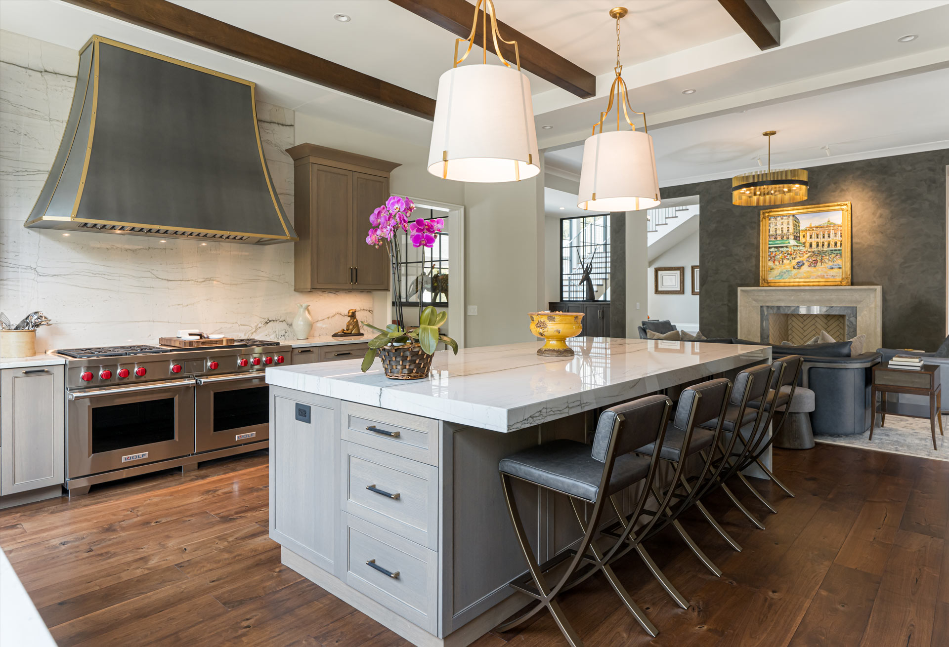 Artisan-designed vent hood in matte zinc with brass accents
