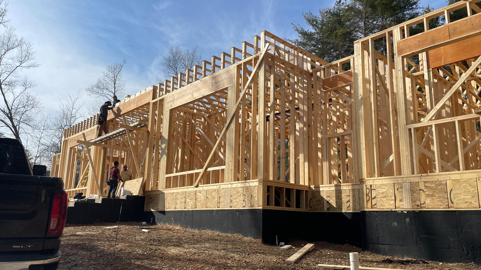 First floor framing underway at new construction home in The Ramble