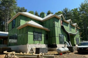 Front elevation of French Manor home design by ACM Design architecture for luxury new home under construction in Asheville, NC