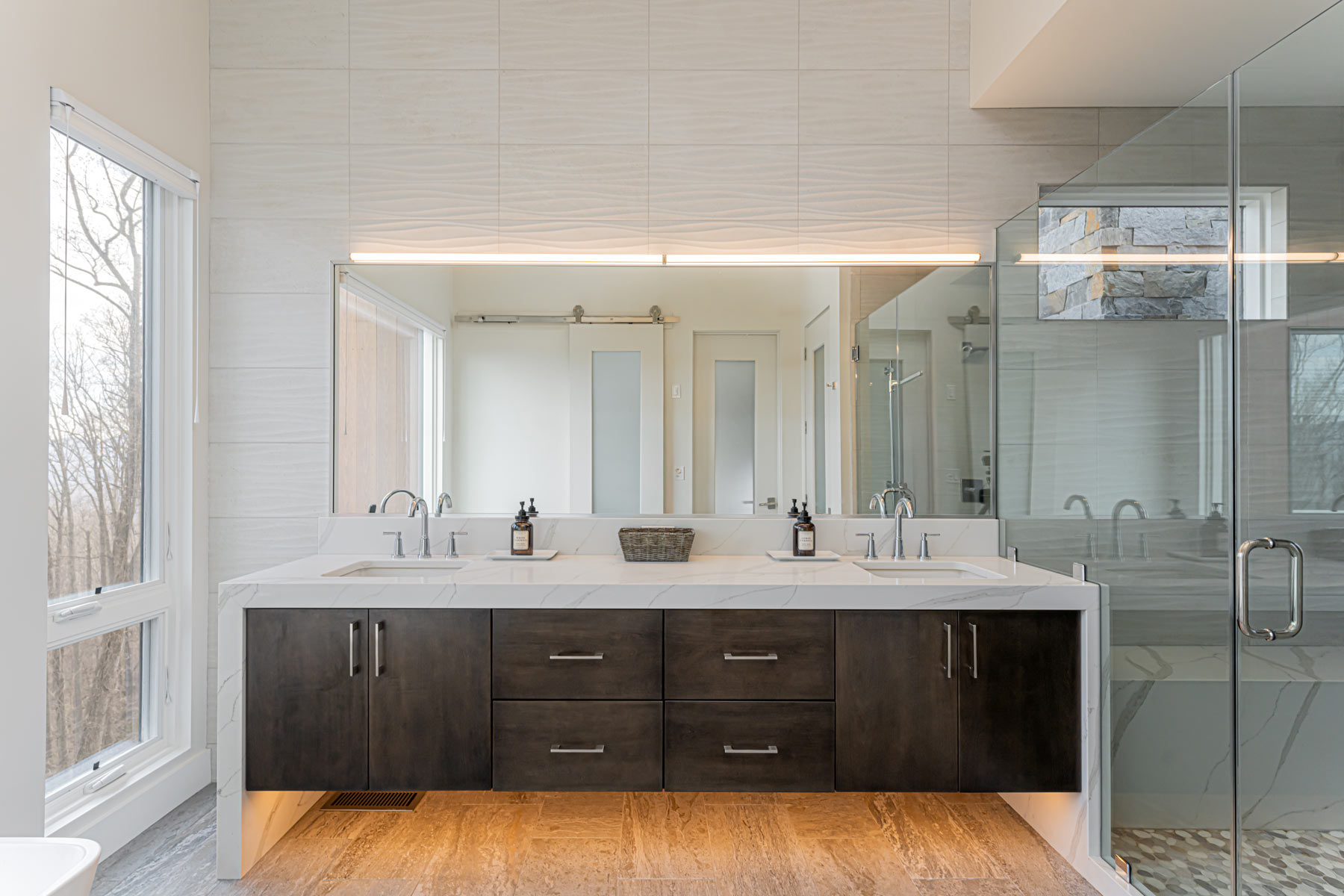 custom-design-bath-vanity-waterfall-stone-abutts-glass-shower-wall