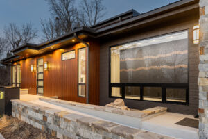 Seamlessly joining the existing structure to the new addition by creating a hallways space for the transition. Élitis handmade wallpaper