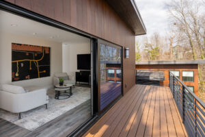 Large format sliding doors open second floor inlawysuite to deck with mountain views.