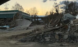 Biltmore Village large piles of washed up debris from the flood of the Broad River in Asheville, NC from Hurricane Helene, 2024