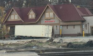 Biltmore Village McDonalds with shipping crate washed into parking lot by the Broad River flood from Hurricane Helene in Asheville, NC