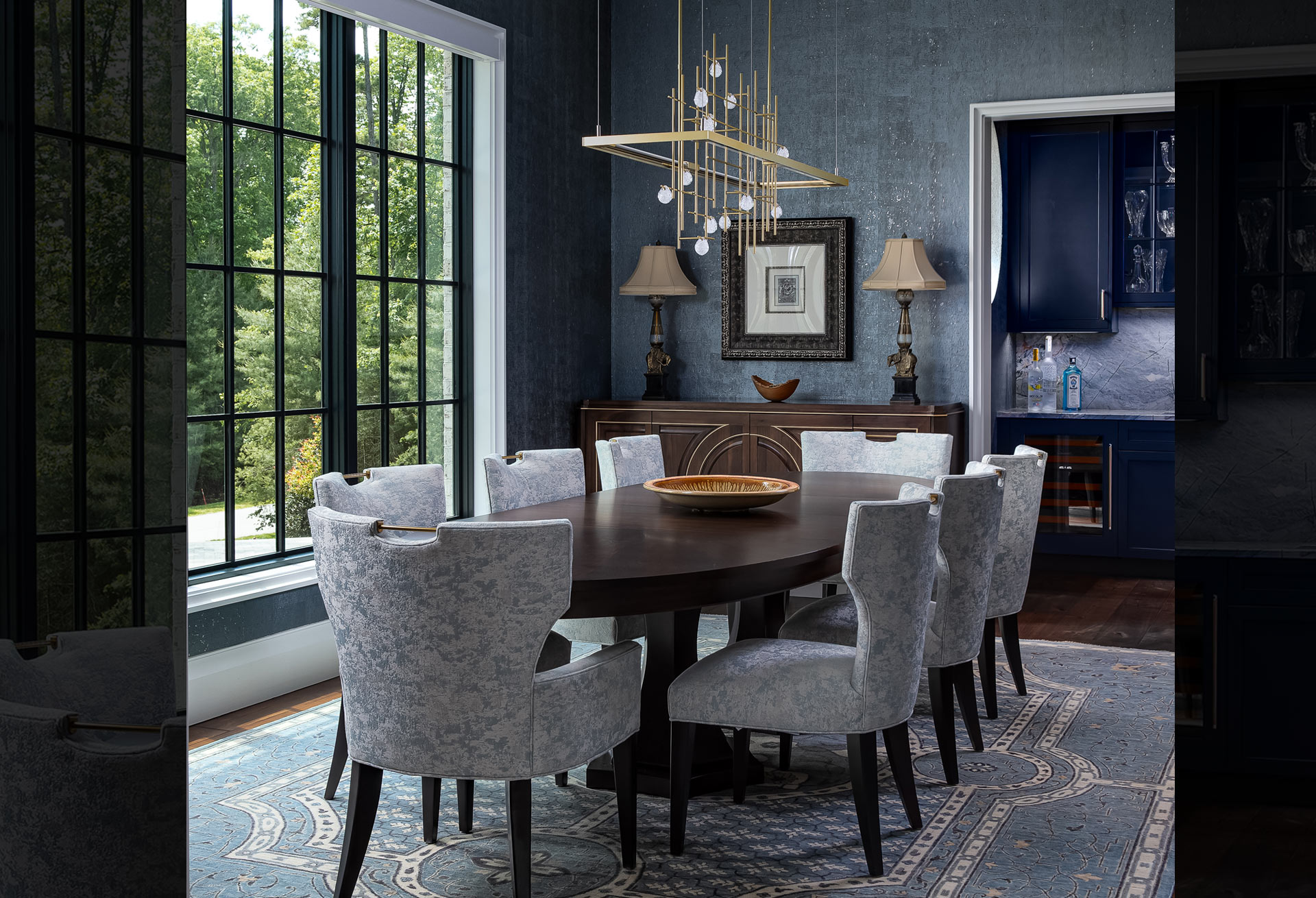 8- seat oval dining table in blue dining room with classic, elegant, timeless design