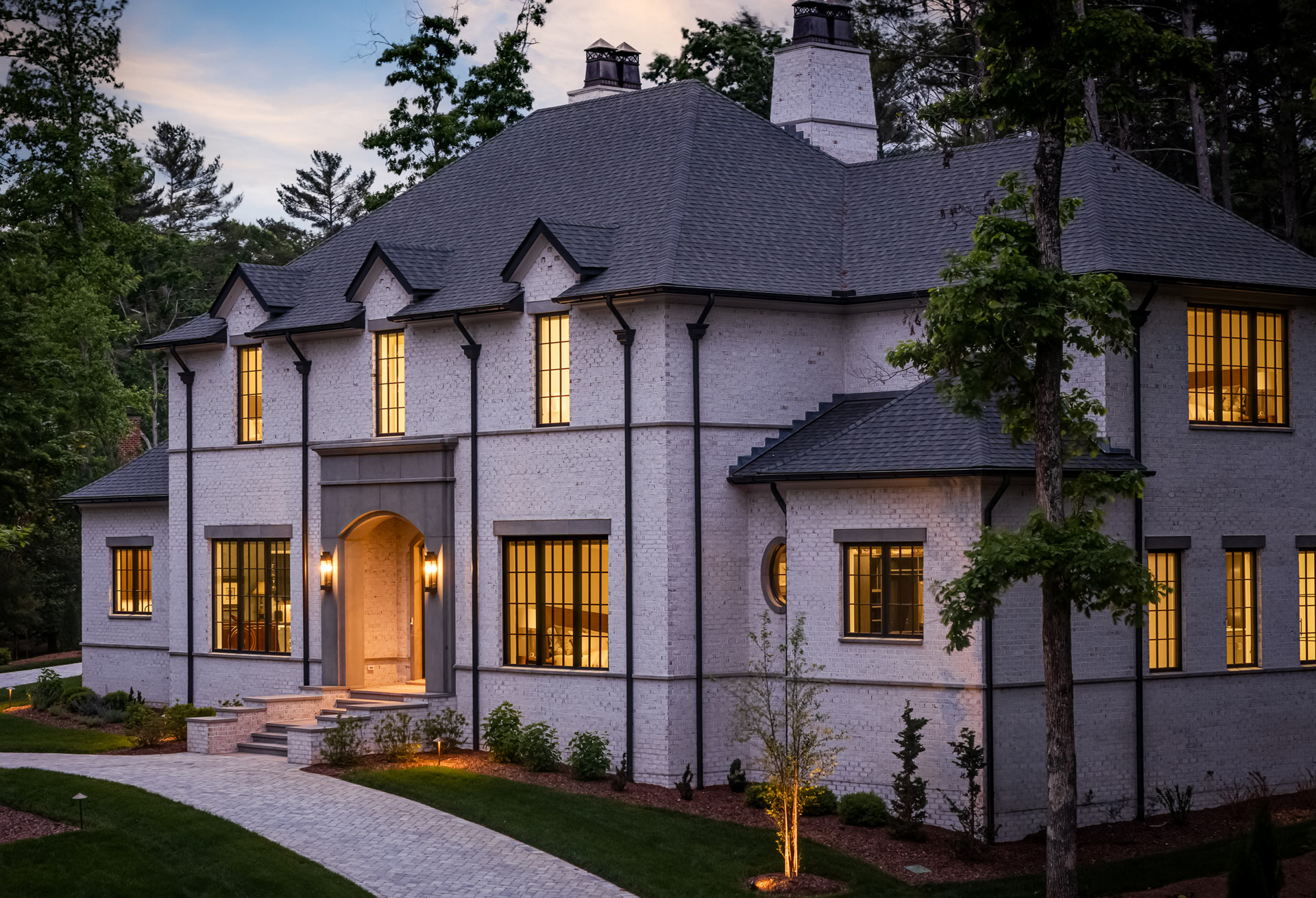night-glow-white-brick-french-manor-home-western-north-carolina